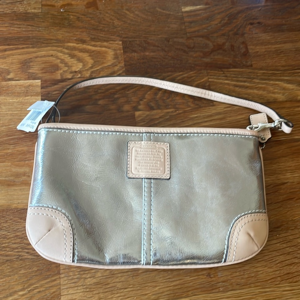 NWT coach clutch wristlet. Silver and tan contrasting leather